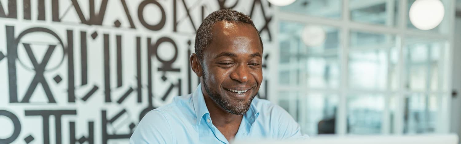 A Nigerian small business owner reviewing sales and inventory on the Retailrise dashboard